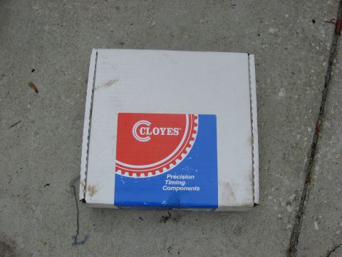 1994 Ford Bronco - A box of automotive timing components is shown on a concrete surface.