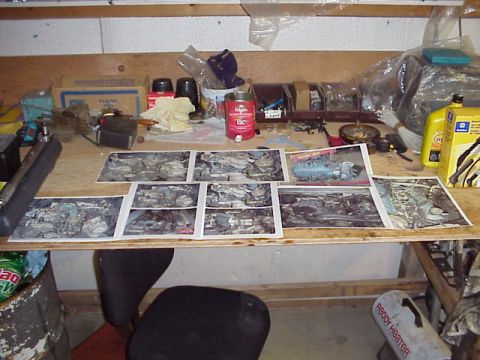 1989 Ford Bronco - Workbench displays photos of engine components alongside various tools and automotive fluids.