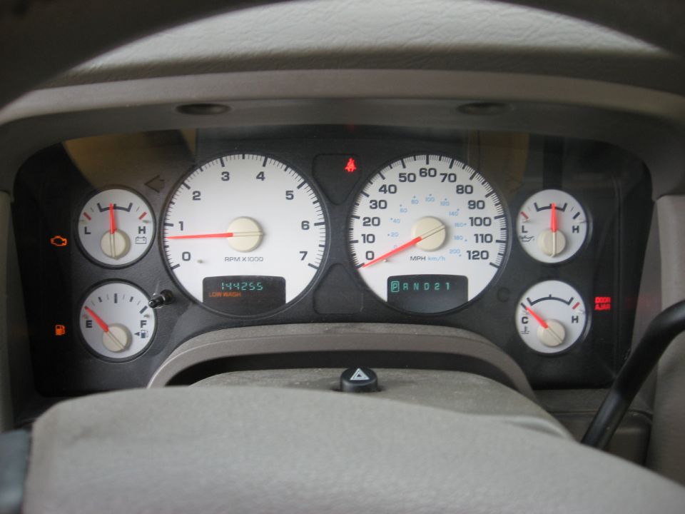Interior dashboard gauges with odometer reading 144255 and PRND21 indicator