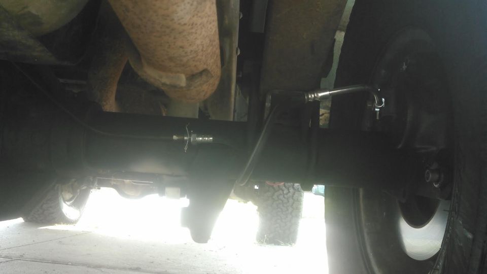 had to make a new brake line. the brake hose is a stock Chevy brake hose for JB5 brakes to match the JB5 caliper I used. the brake hoses are quite long so this is how I have them by bending the hard section of the hose.

I had ordered a couple weld-on brake line tabs and clips from Ruffstuff that I used to hold the hose ends in place.