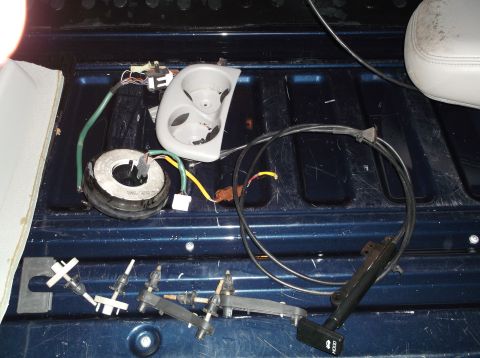 1999 Mercury Grand Marquis - Various car parts are laid out on the bed of a blue pickup truck.