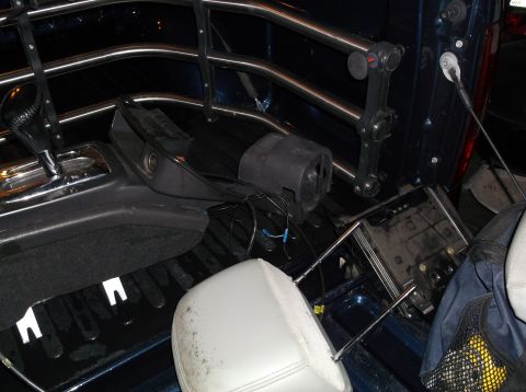 1999 Mercury Grand Marquis - Disassembled interior components are visible in the bed of a blue pickup truck.
