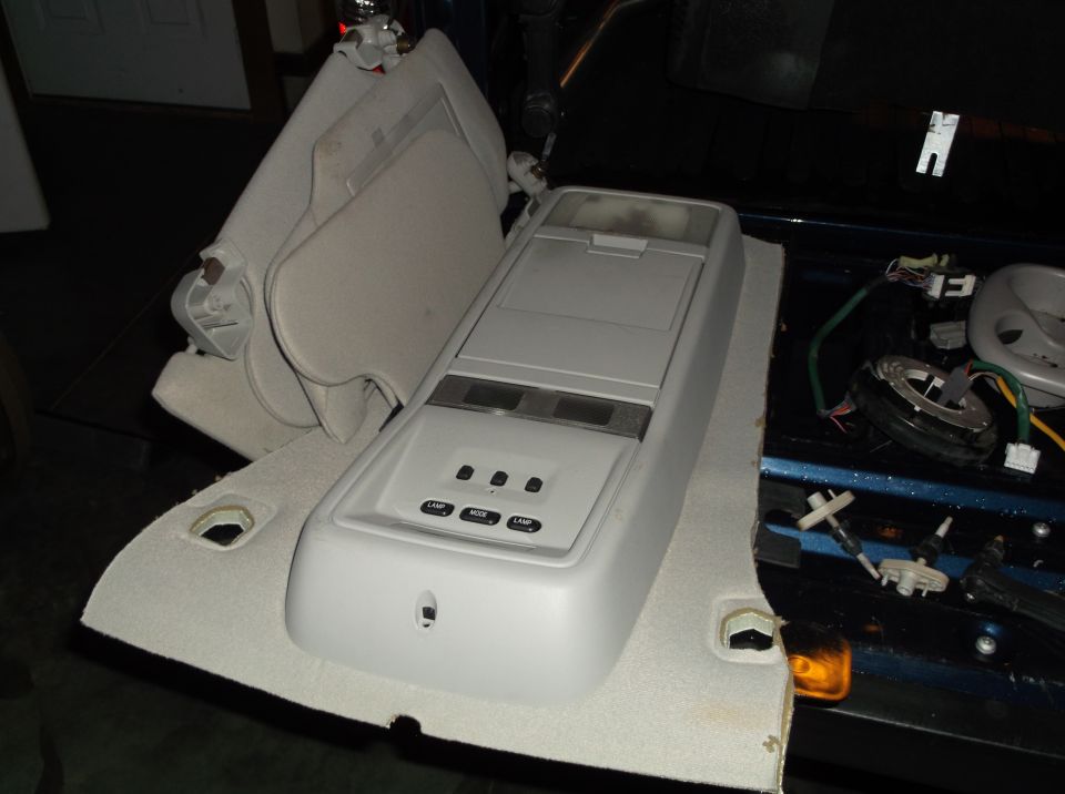 Overhead console and sun visors removed from vehicle interior