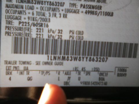 1999 Mercury Grand Marquis - Close-up of a vehicle's VIN and tire pressure information label.