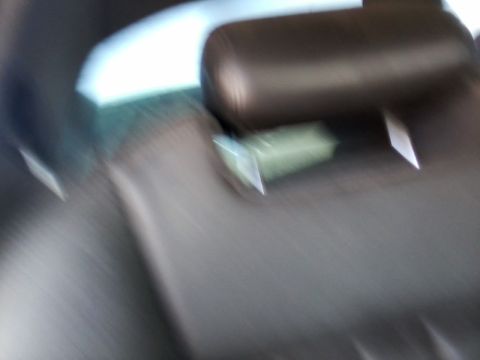 1999 Mercury Grand Marquis - Interior view of a car with a blurry headrest and seat visible.