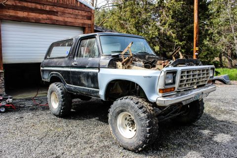 1979 Ford Bronco - This Ford Bronco is undergoing some work, with its hood open and engine exposed.