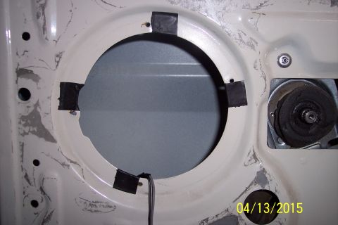 1990 Ford Bronco - Door panel showing speaker mounting area and some internal components.