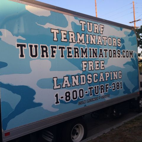1968 Ford Mustang - A box truck displays advertising for 'Turf Terminators' with a phone number and website.