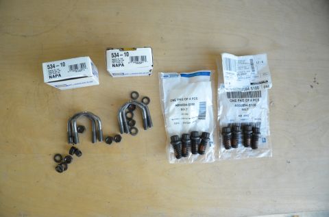 1979 Ford Bronco - Collection of drive shaft U-bolts and assorted bolts, some in original packaging.