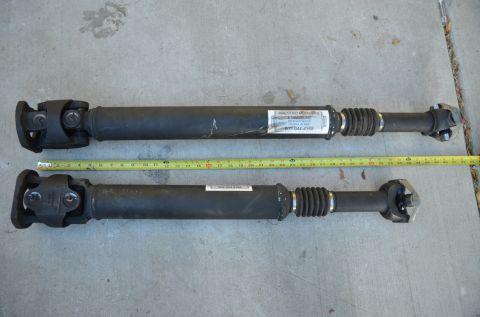 1979 Ford Bronco - Two drive shafts are shown side-by-side with a tape measure for scale.