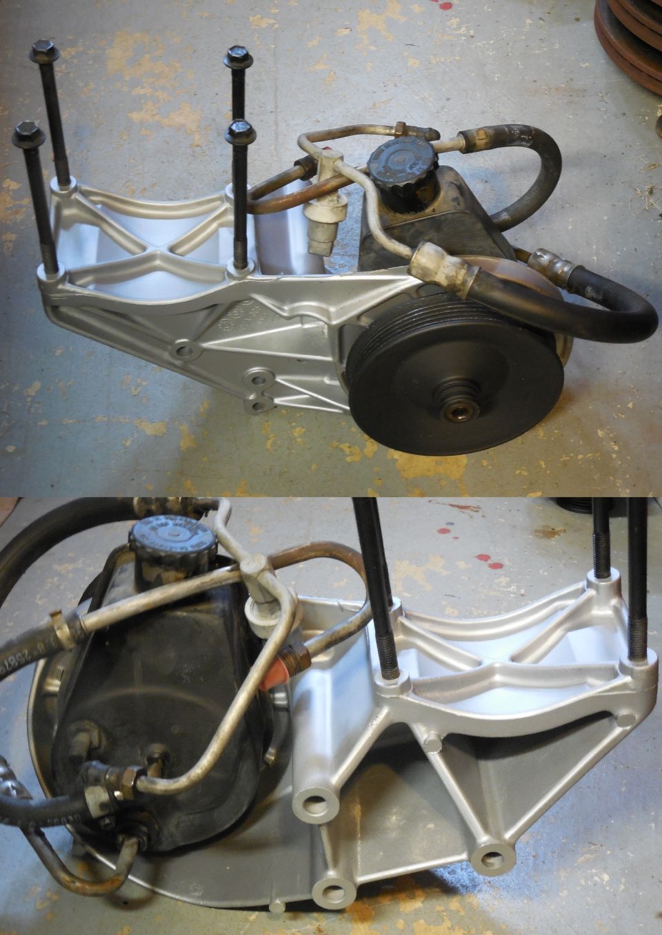 Refinished silver aluminum accessory bracket with power steering pump, pulley and hoses