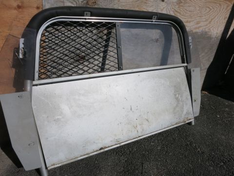 1991 Ford LTD Crown Victoria - This partition appears to be from a vehicle, possibly for cargo or passenger separation.