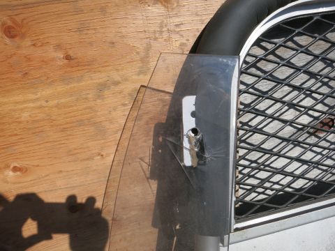 1991 Ford LTD Crown Victoria - Close-up of car door glass and grille, possibly for a project vehicle.