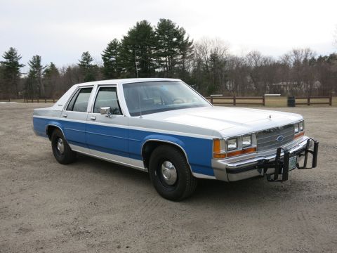 1991 Ford LTD Crown Victoria - This 1991 Ford Crown Victoria LTD features a two-tone paint scheme and a front push bar.