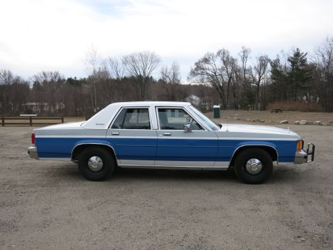 1991 Ford LTD Crown Victoria - This 1991 Ford Crown Victoria LTD is presented in a two-tone blue and silver paint scheme.