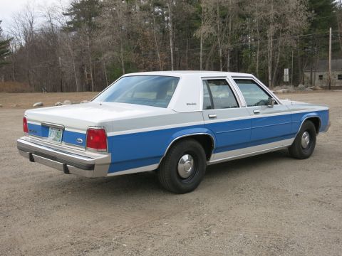 1991 Ford LTD Crown Victoria - This Ford Crown Victoria has a distinctive two-tone paint scheme with blue and gray sections.