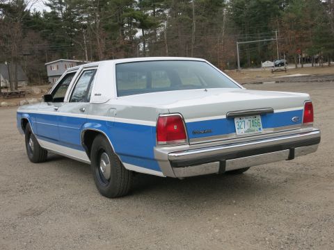 1991 Ford LTD Crown Victoria - This 1991 Ford Crown Victoria has a distinctive blue and gray paint scheme with a chrome bumper.