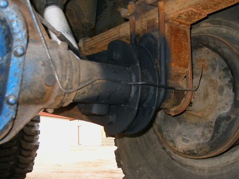 1996 Ford Bronco - Rear axle and suspension components of a vehicle are shown in this close-up detail shot.