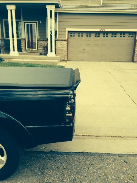 2001 Ford Ranger - Rear view of a black 2001 Ford Ranger pickup truck parked in a driveway.