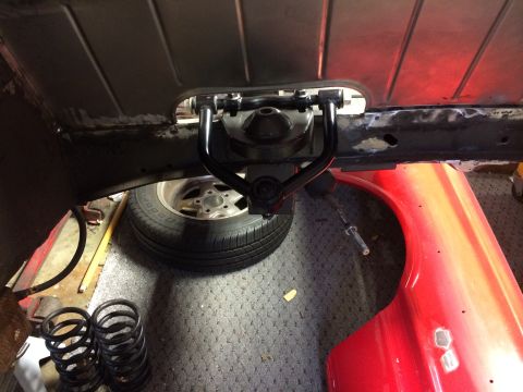 1964 Ford Fairlane - Underside view of a vehicle's suspension system, showing the upper control arm and related parts.