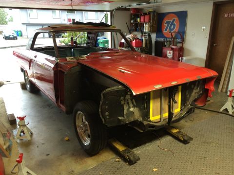 1964 Ford Fairlane - A red 1964 Ford Fairlane is parked in a garage, appearing to be in the process of restoration.