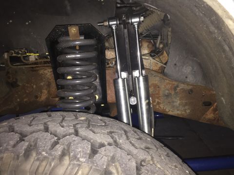 1994 Ford Bronco - Suspension components including a coil spring and dual shock absorbers are visible.