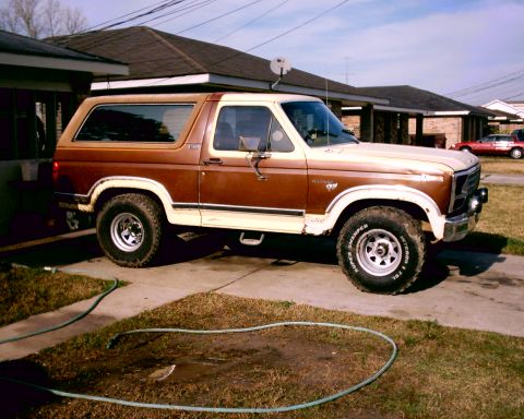1980 Ford Bronco - This two-tone Ford Bronco is parked in a residential driveway.