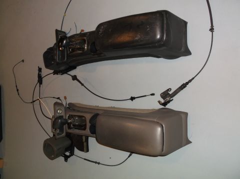 1999 Mercury Grand Marquis - Two disassembled car dashboard sections with center consoles and associated wiring are displayed.