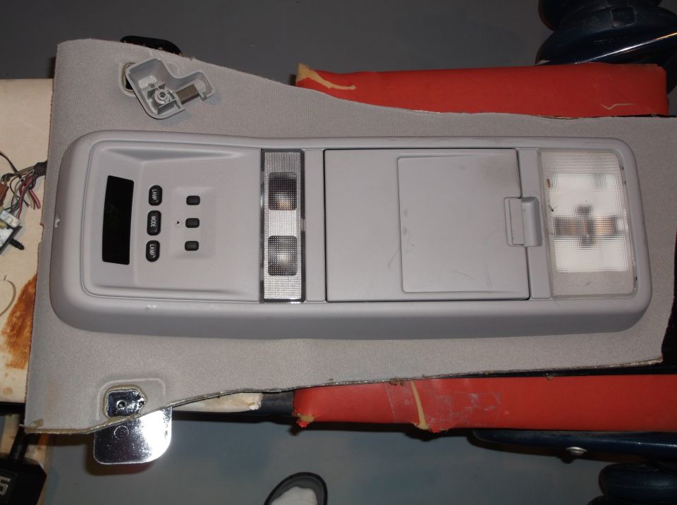 Overhead console with buttons labeled 'MODE', 'DOOR', 'OFF', and two lights