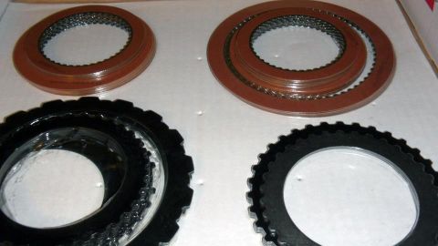 2001 Mercury Grand Marquis - Transmission clutch plates shown laid out on a surface.