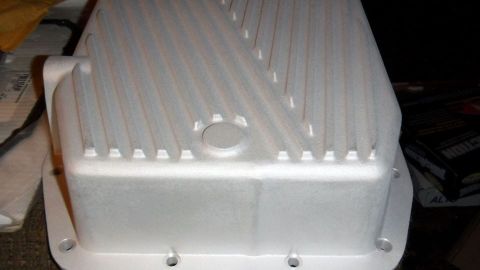 2001 Mercury Grand Marquis - An aluminum transmission pan with a textured surface and cooling fins is shown.