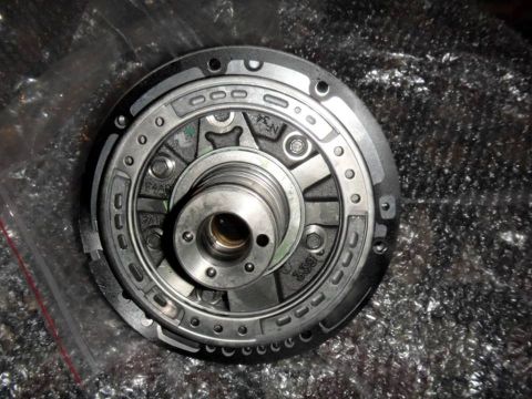 2001 Mercury Grand Marquis - Close-up of a transmission torque converter part, showing internal workings and some markings.