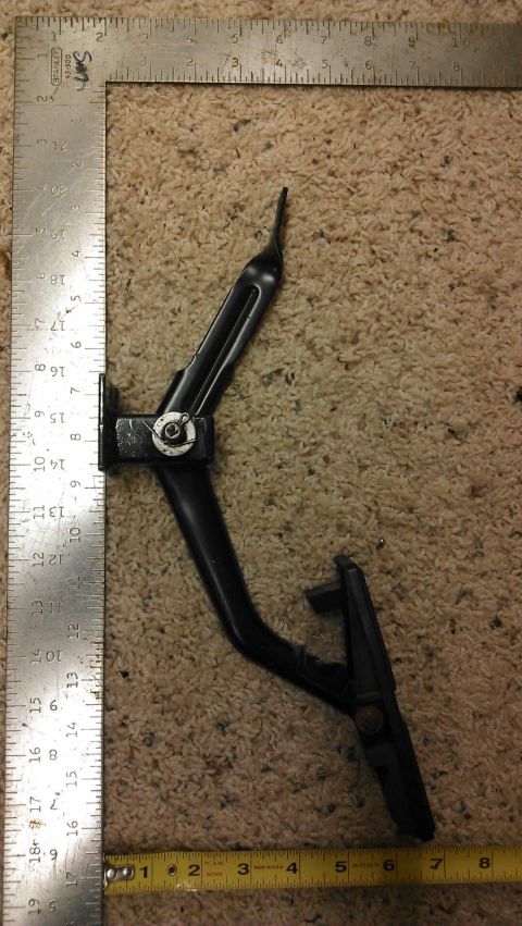 1964 Ford Fairlane - A car brake pedal assembly is shown next to measuring tools.