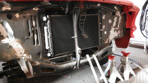 1964 Ford Fairlane - Front end of a 1964 Ford Fairlane, showing the radiator and surrounding structure during restoration.