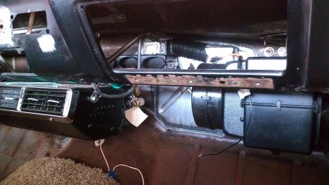 1964 Ford Fairlane - Aftermarket AC unit installed in a car's interior, showing the dashboard and ductwork.