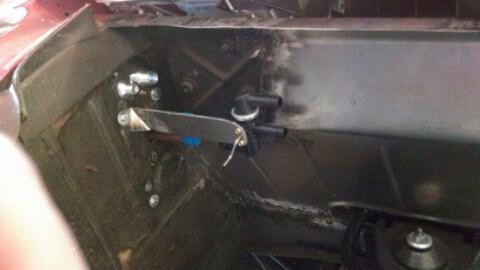 1964 Ford Fairlane - Close-up of a heater control valve assembly attached to the vehicle's firewall.