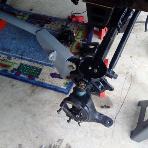 1978 Ford Bronco - Close-up view of a vehicle's suspension component, likely during a repair or upgrade.