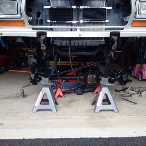 1978 Ford Bronco - Front suspension of a 1978 Ford Bronco is raised on jack stands for service.
