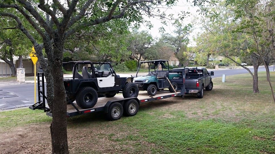 Jeep Wrangler on trailer, side view, black and white