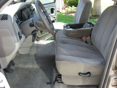 1994 Ford Bronco - Interior of a 2004 Dodge Ram 1500, showing the driver's side and center console.