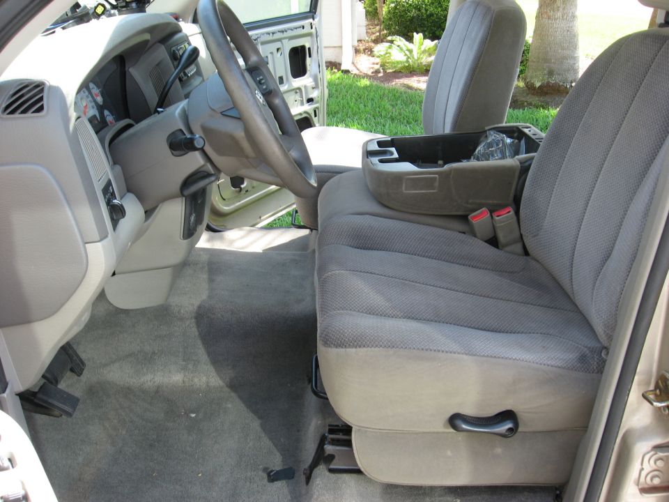 Interior view of a 2004 Dodge Ram 1500 showing the driver's seat, dashboard, and center console