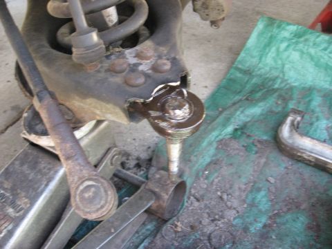 1994 Ford Bronco - This image shows a close-up of a vehicle's suspension system undergoing repair or maintenance.
