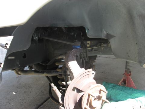 1994 Ford Bronco - Front suspension components, including brake rotor and ball joint, are visible.
