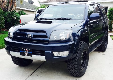 2005 Toyota 4Runner - This 2005 Toyota 4Runner features a prominent hood scoop and aggressive off-road tires, suggesting it is modified for off-road use.