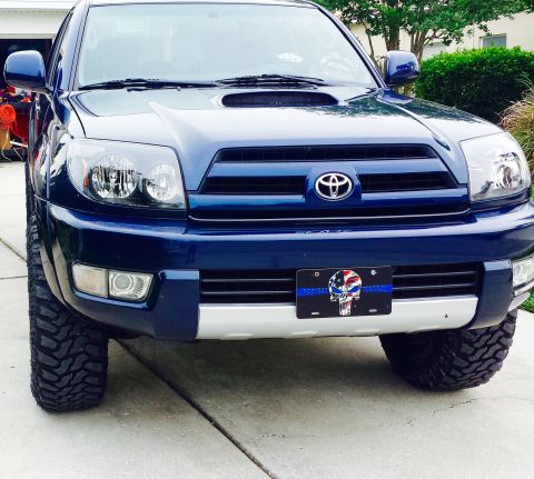 2005 Toyota 4Runner - This blue 2005 Toyota 4Runner features a front-facing view, its aftermarket tires and a distinctive custom license plate.