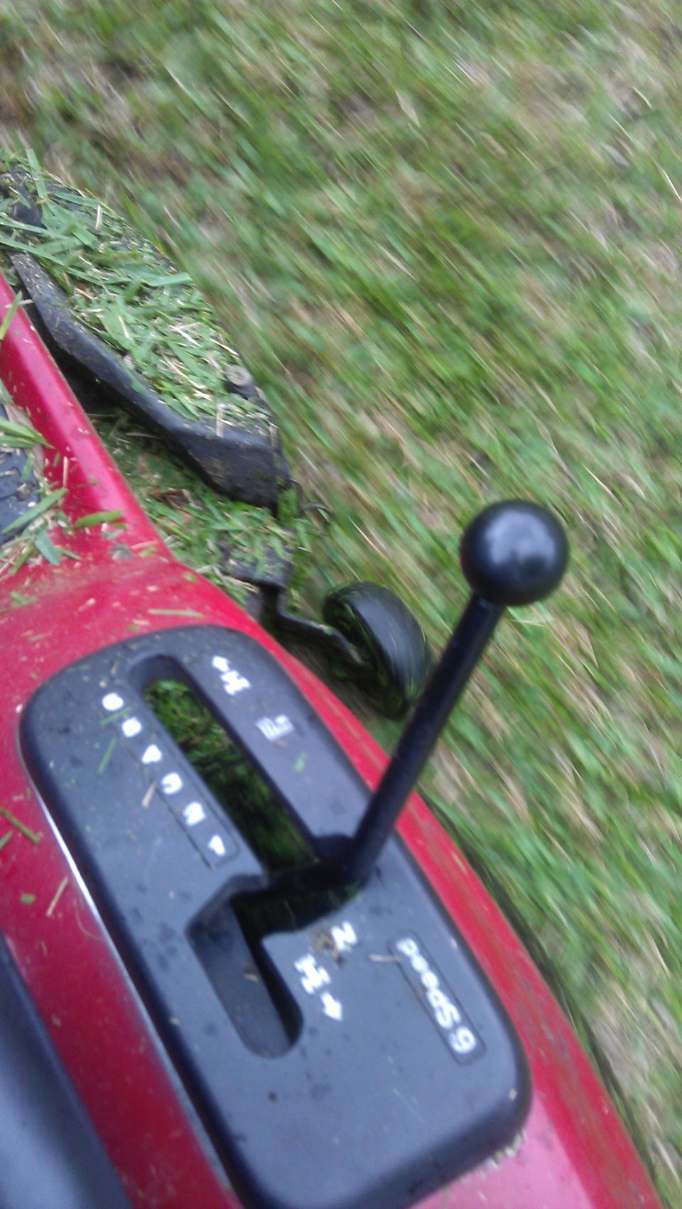 Red riding mower gear shift with '6 Speed' label