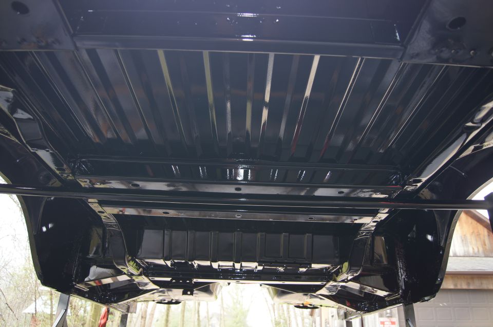 Underside of a vehicle, showing frame and suspension components