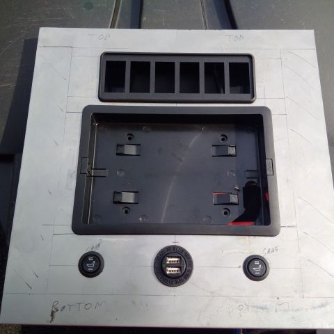 1978 Ford Bronco - A custom-made aluminum panel designed for vehicle interior modifications, including switch blanks and USB ports.