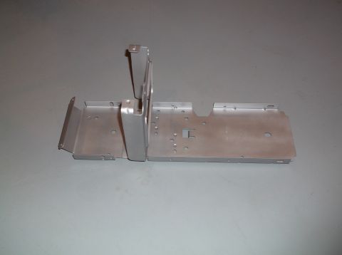 1999 Mercury Grand Marquis - A metal bracket, likely part of a vehicle's center console, is shown against a neutral background.
