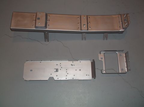 1999 Mercury Grand Marquis - Unidentified metal console components are displayed on a gray surface, with a 'Supermotors.net' watermark visible.